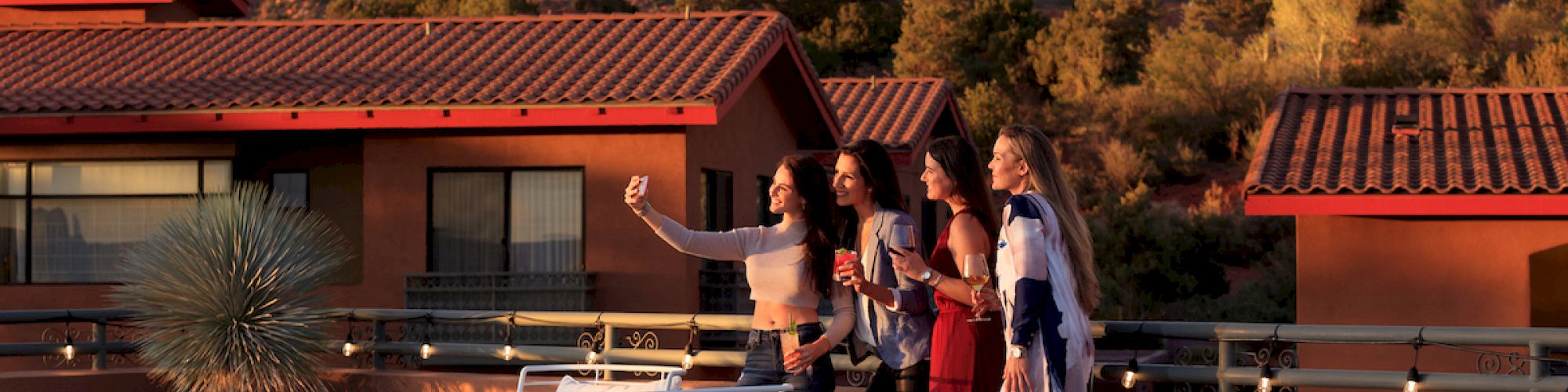 women enjoying rooftop drinks